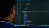 a-man-looking-at-a-computer-screen.jpg a man looking at a computer screen